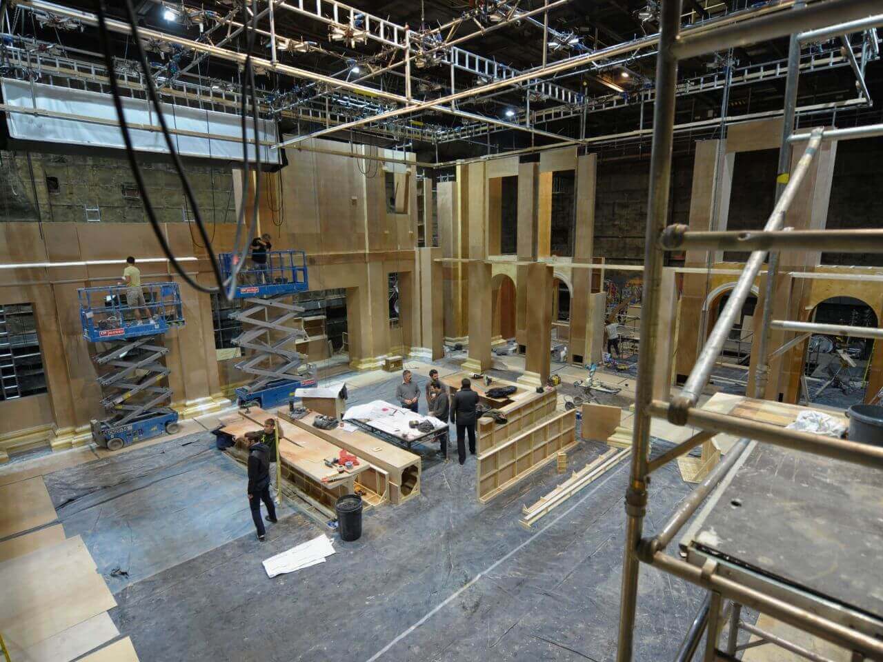 Tom & Production Designer from above - The Take Set Aerial shot of Tom Overton and a designer discussing set drawings for The Take.