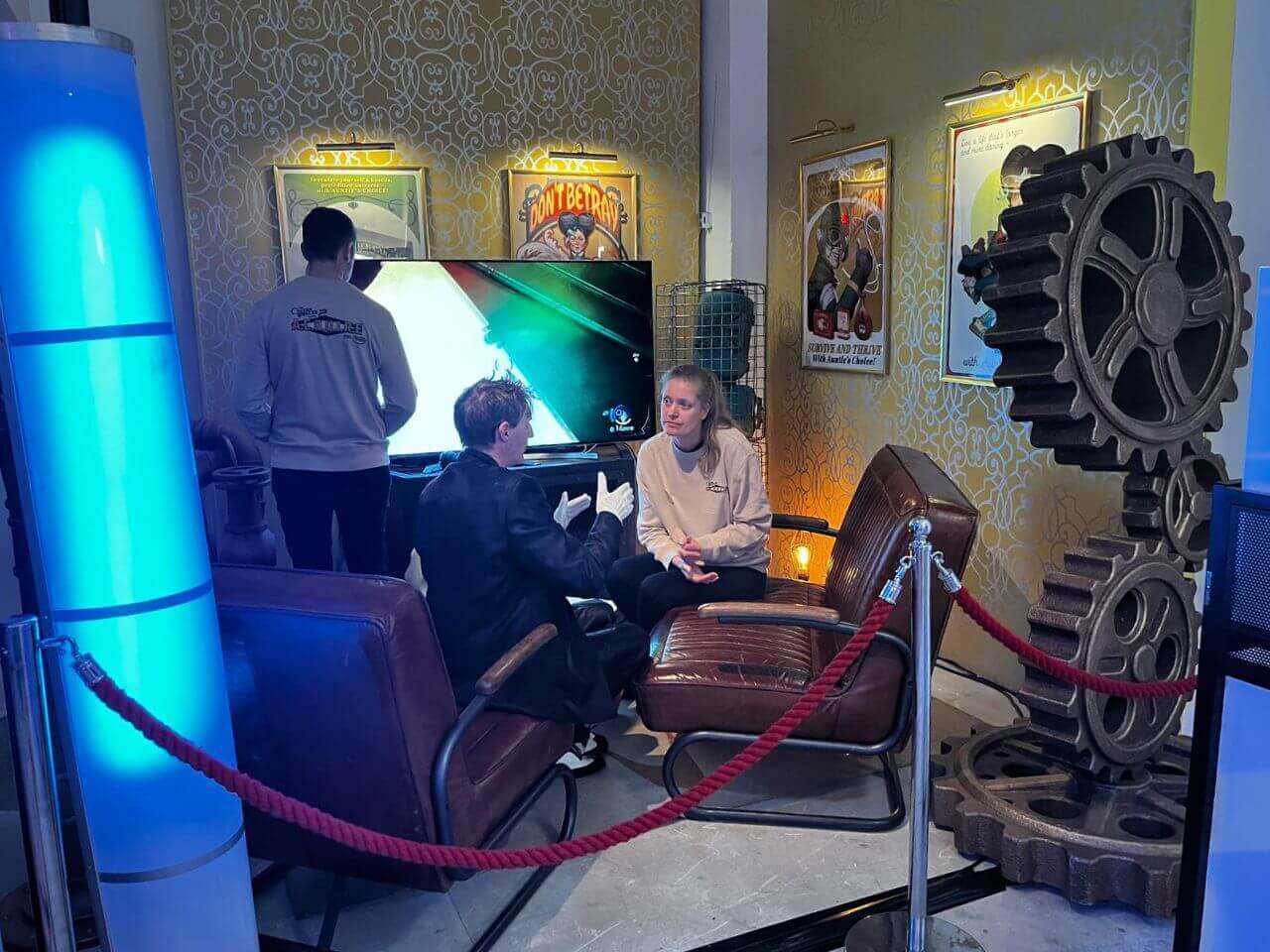 Xbox - The Outer World 2 - Experience Game Release - 6 Seated gameplay area within The Outer Worlds 2 experiential pop-up, surrounded by bespoke scenic props and industrial-style set elements.