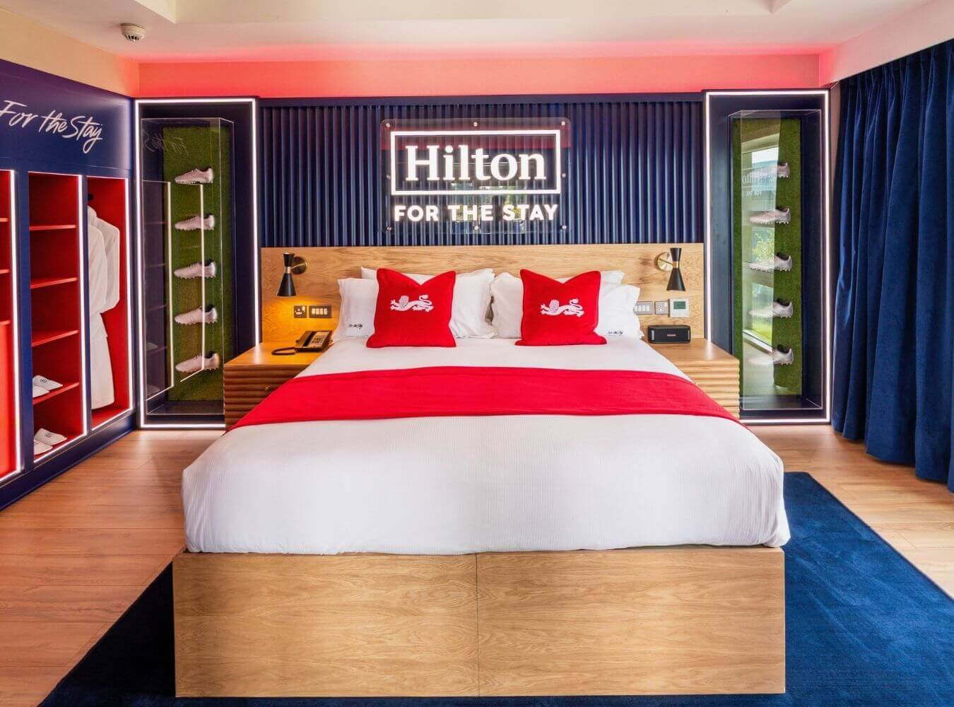 Hilton Lionesses Suite Installation Hilton Lionesses themed hotel bedroom with custom joinery, lighting and branded display units