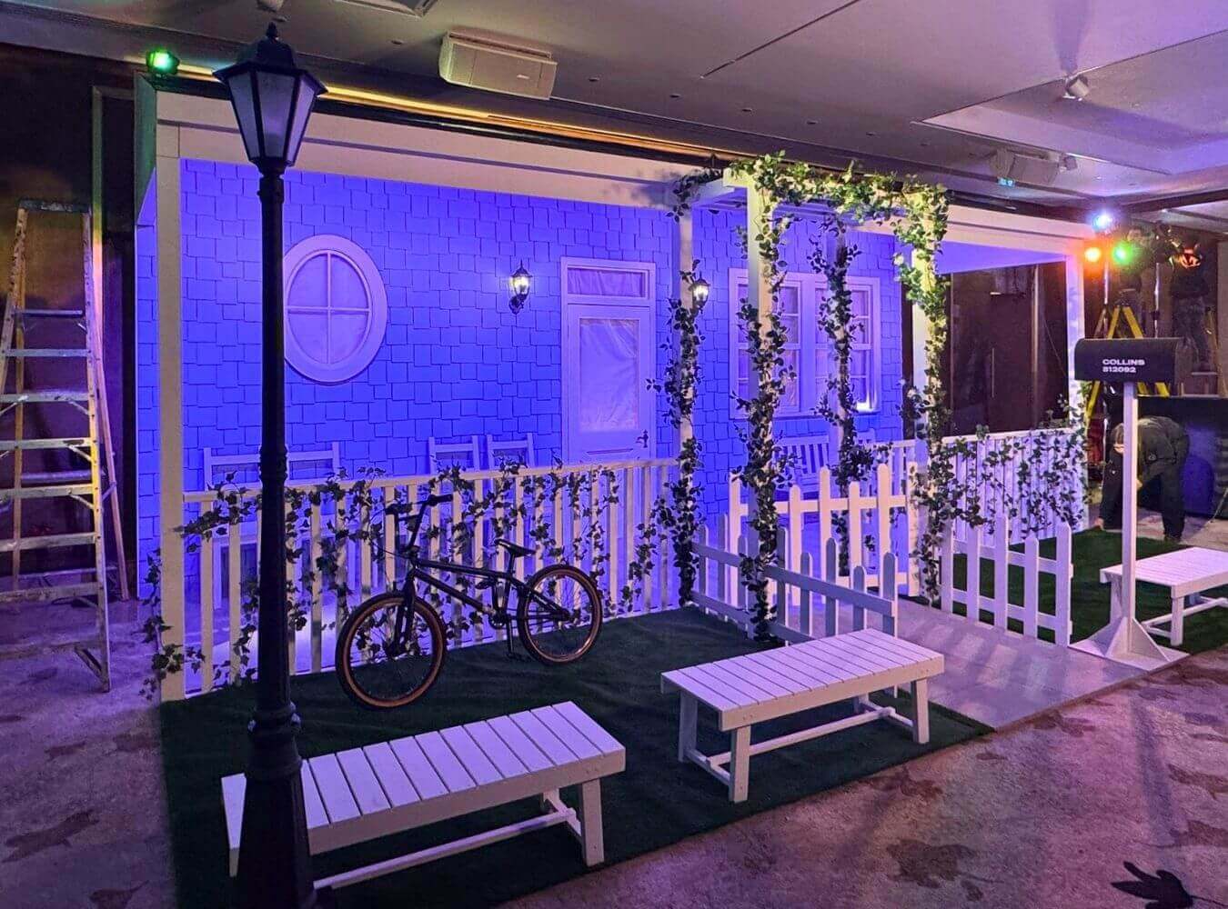 Experiential Set for Brand Launch Event Stylised exterior house set with picket fence and lighting used for influencer event production