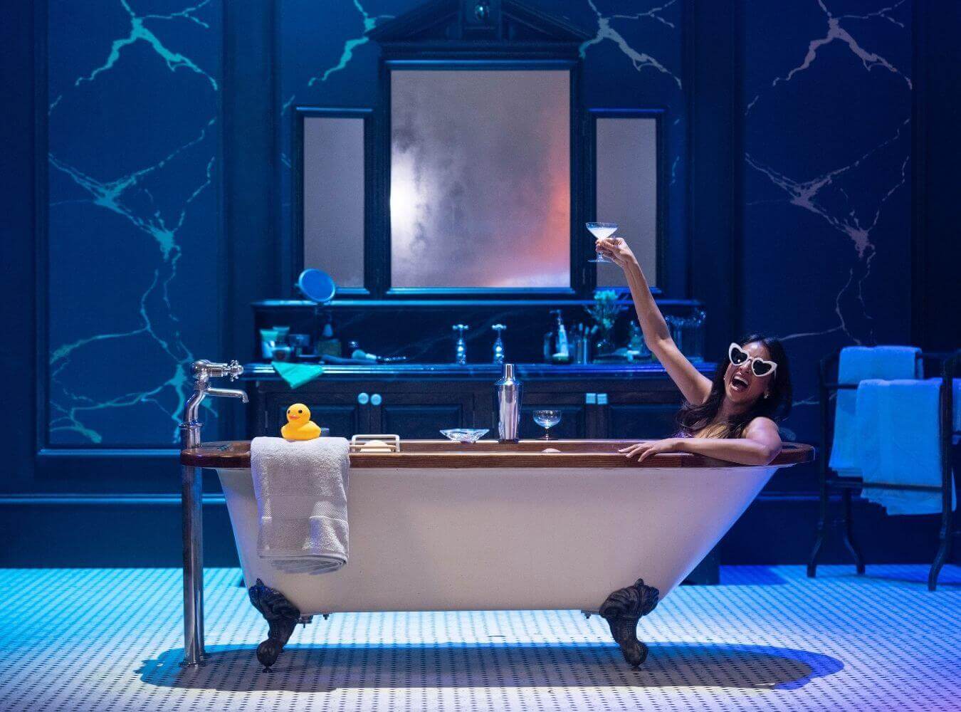 Set Build for Influencer Event Activation Immersive bathroom-style set with freestanding bath and dramatic lighting for a brand launch event