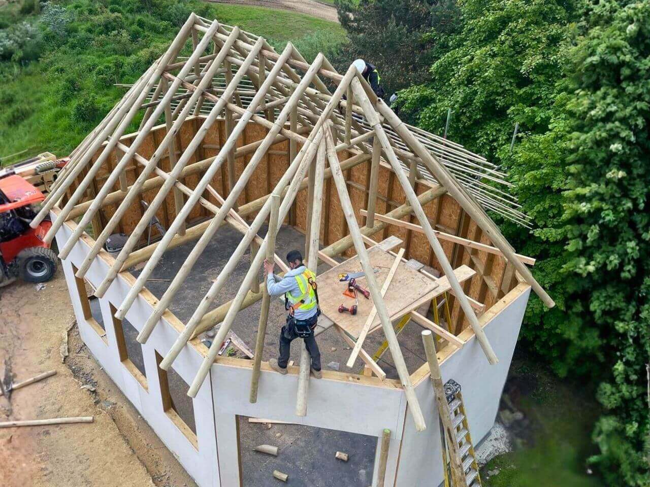 3 Roundwood Roof Frame Installation at Kynren Totom team installing a large roundwood timber roof frame for the Viking Village at Kynren in Bishop Auckland.